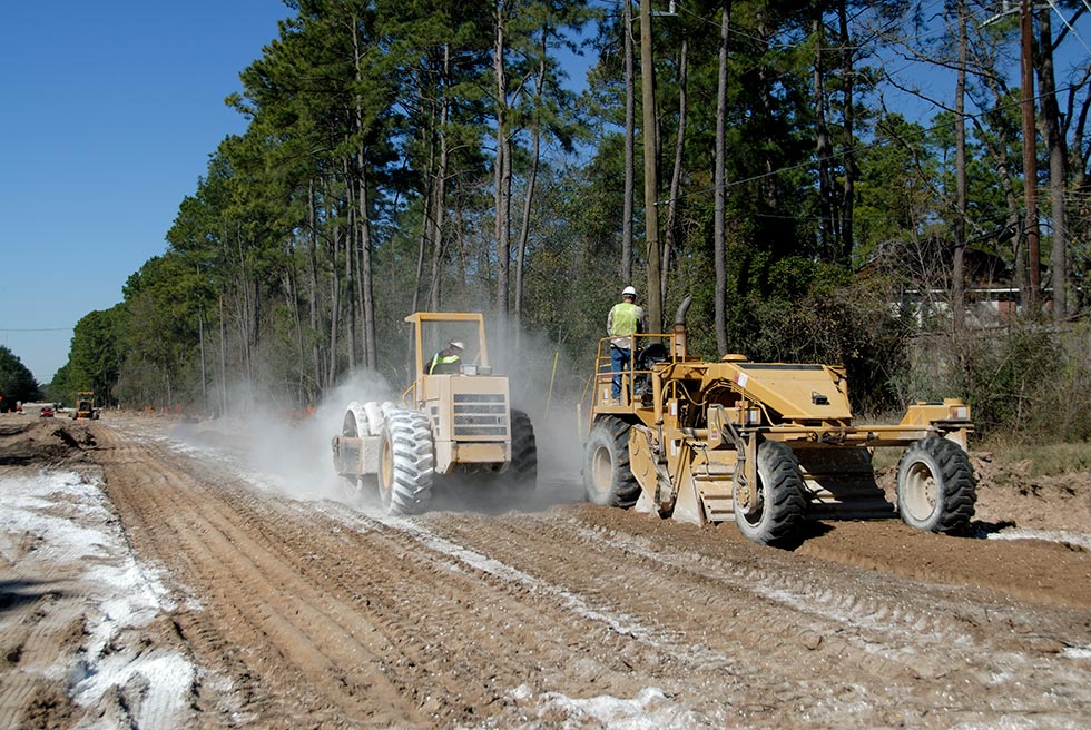 Road Construction- Tiller And Compactor Stabilizing The Soil